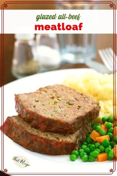 slices of meatloaf on a plate with mashed potatoes and peas and carrots with text overlay "All Beef Glazed Meatloaf"