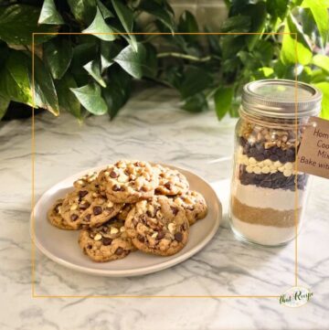 plate of triple chocolate chip cookies with a jar filled with cookie mix