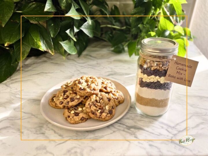 plate of triple chocolate chip cookies with a jar filled with cookie mix