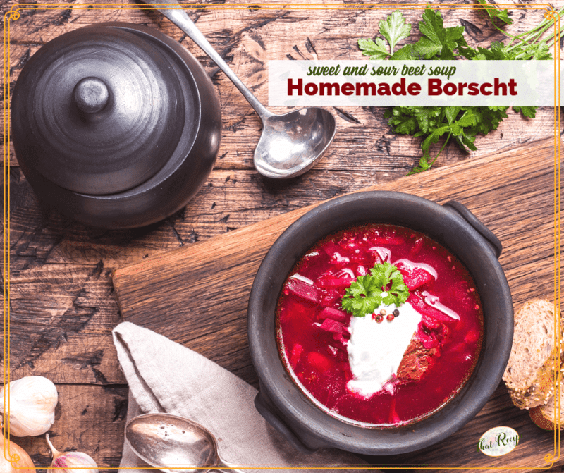 bowl of borscht on a table with text overlay "Homemade Borscht sweet and sour beet soup"