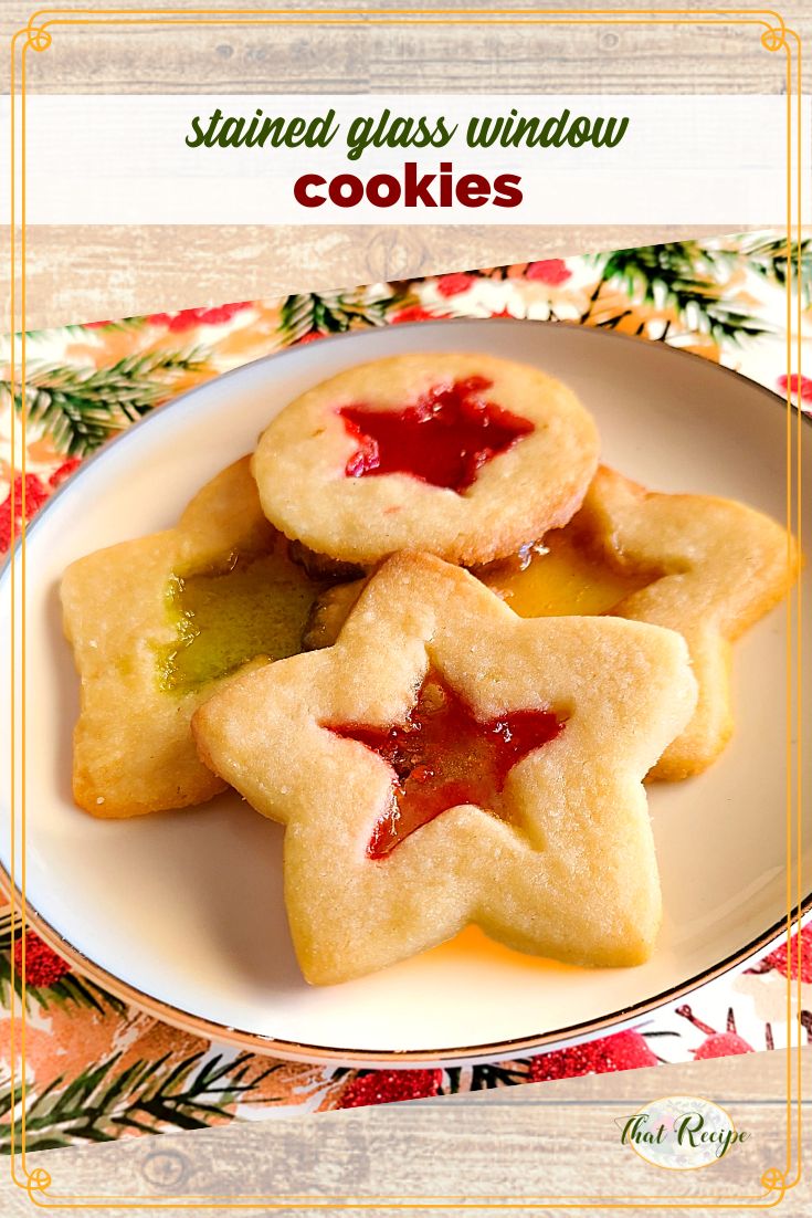 Christmas Cookies on a plate with text overlay "stained glass window cookies"