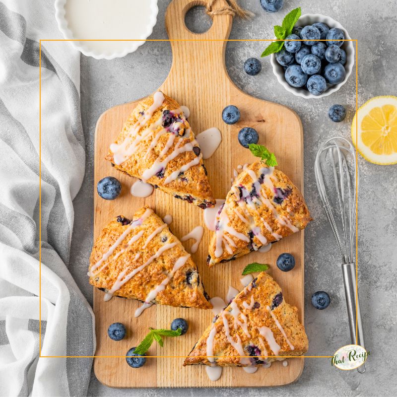 lemon blueberry scones on a cutting board