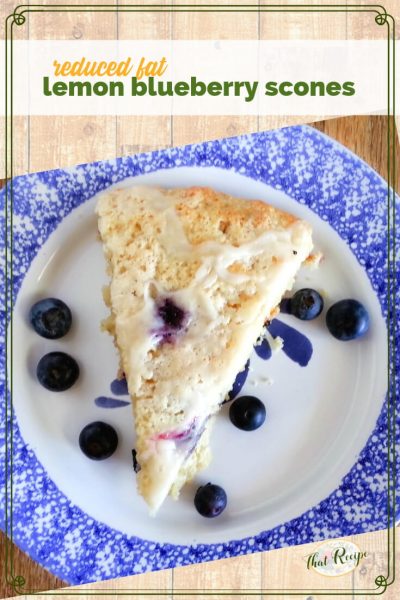 lemon blueberry scone on a plate with fresh blueberries