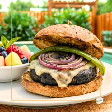 burger topped with a chile pepper and grilled red onion slice