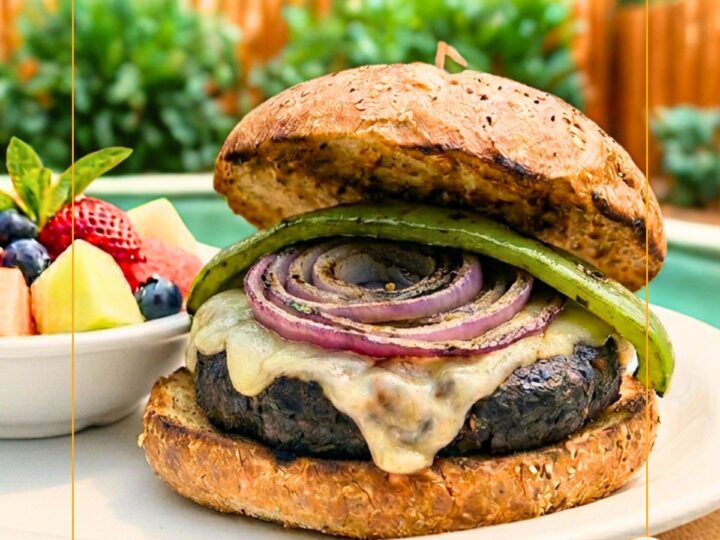 burger topped with a chile pepper and grilled red onion slice