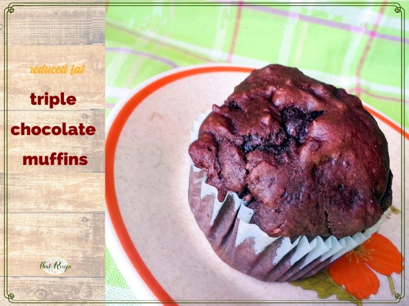 triple chocolate muffin on a plate with text overlay "reduced fat triple chocolate muffin"