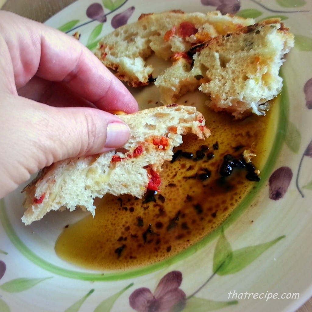 Caprese Bread dipped in olive oil and balsamic vinegar