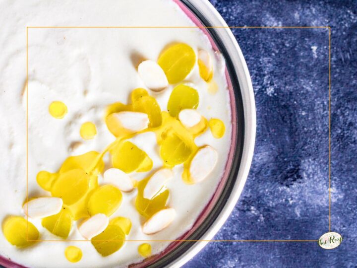white gazpacho - soup topped with grapes and olive oil in a bowl, ajoblanco