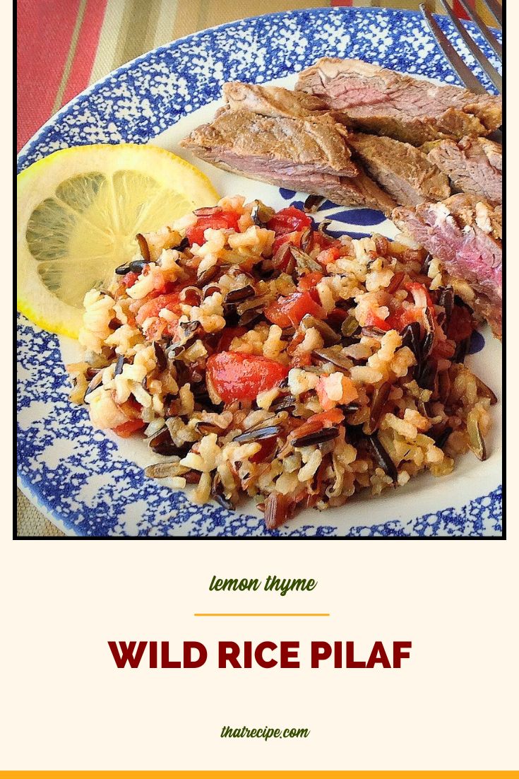 rice pilaf on a plate with steak slices