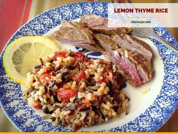 rice pilaf on a plate with steak slices