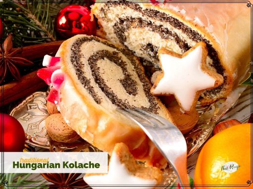 poppy seed roll on a plate with text overlay "traditional Hungarian Kolache"