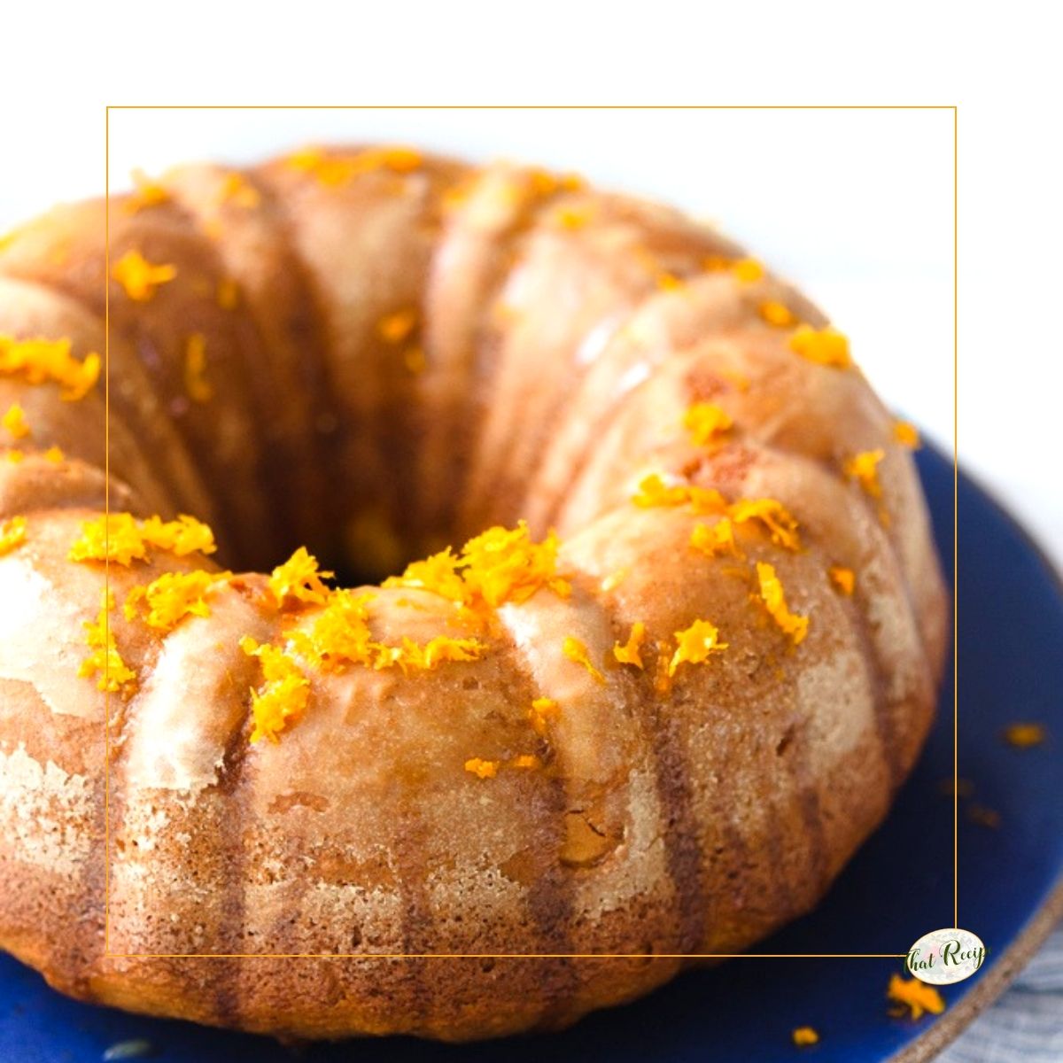 bundt cake on a plate topped with orange zest