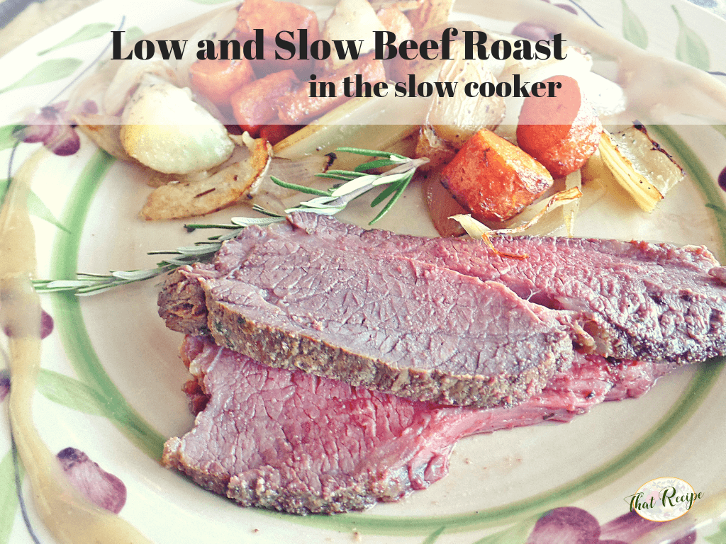 Beef roast on a plate with roasted root vegetables