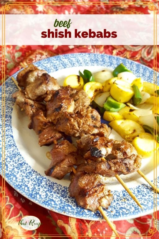 shish kebabs and grilled vegetables on a plate with text overlay "beef shish kebabs"