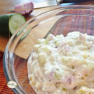 bowl of cucumbers in yogurt with text overlay "Cucumbers in yogurt Jajuk: Armenian Summer Soup"