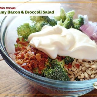 bacon and broccoli salad ingredients in a bowl with text overlay "lighter version creamy bacon and broccoli salad"