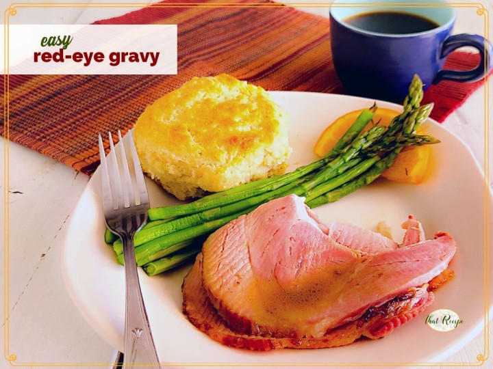 plate of ham, asparagus and biscuit with text overlay "easy red eye gravy"