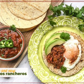 huevos rancheros on a plate with tortillas and a bowl of salsa