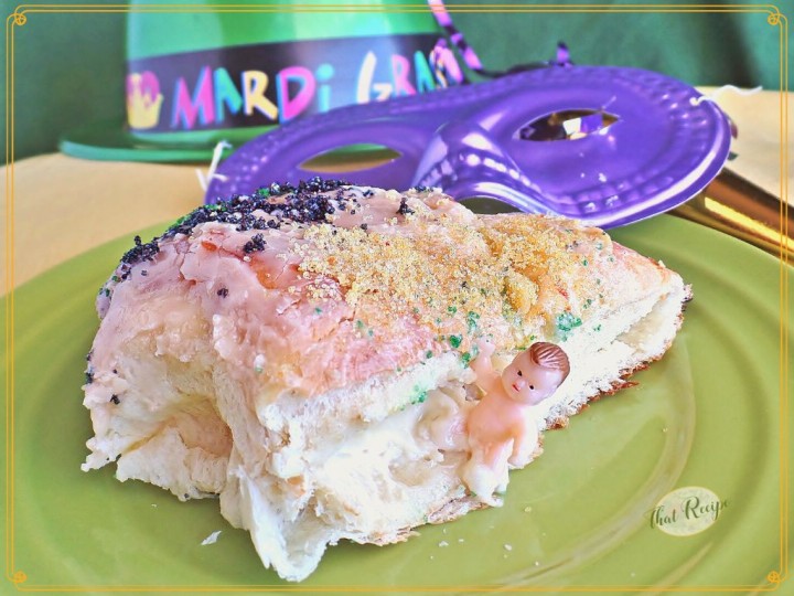 King Cake on a table with text overlay "Cream Cheese filled King Cake"