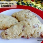 scones on a plate with text overlay "tomato and herb scones"