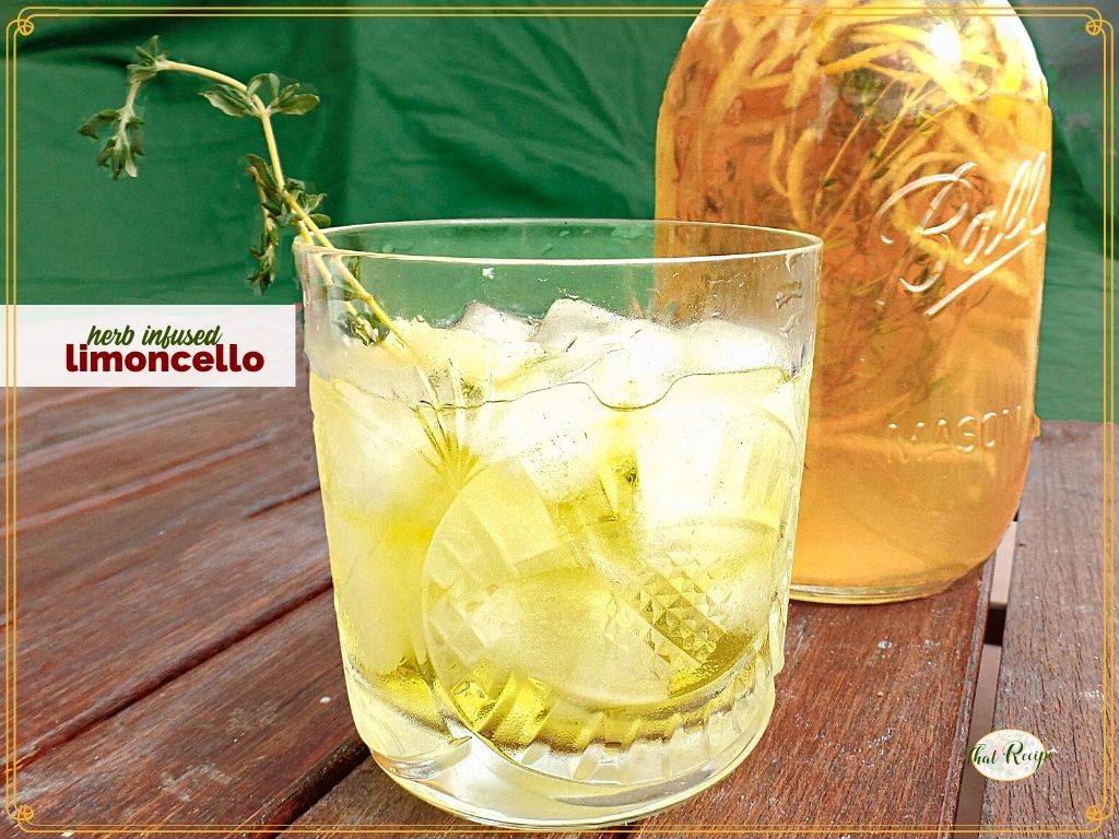 limoncello over ice with mason jar full of homemade limoncello and textoverlay "herb infused limoncello"