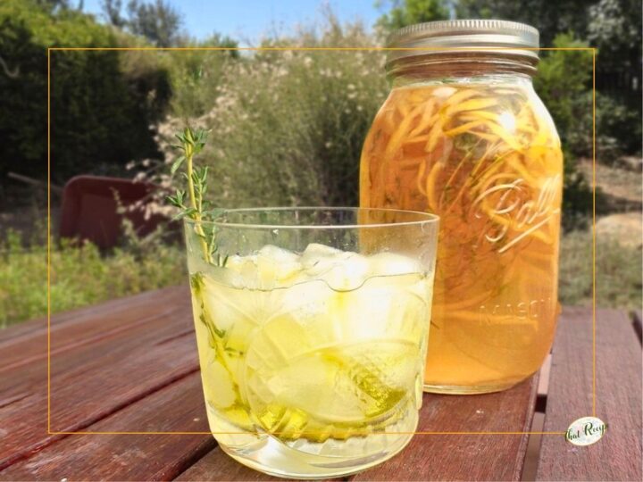 limoncello over ice with mason jar full of homemade limoncello