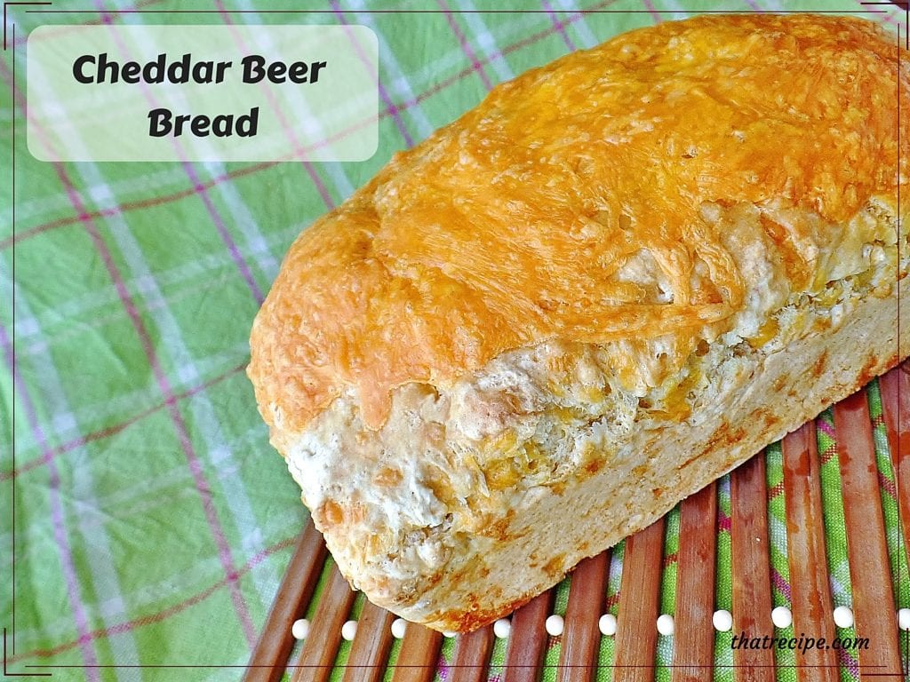Cheddar Beer Bread - easy quick bread made with beer and loaded with cheddar cheese in and on top of the bread.