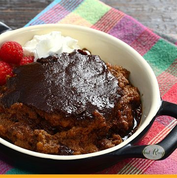 pudding in a black dish with text overlay "Indian Pudding cornmeal pudding"