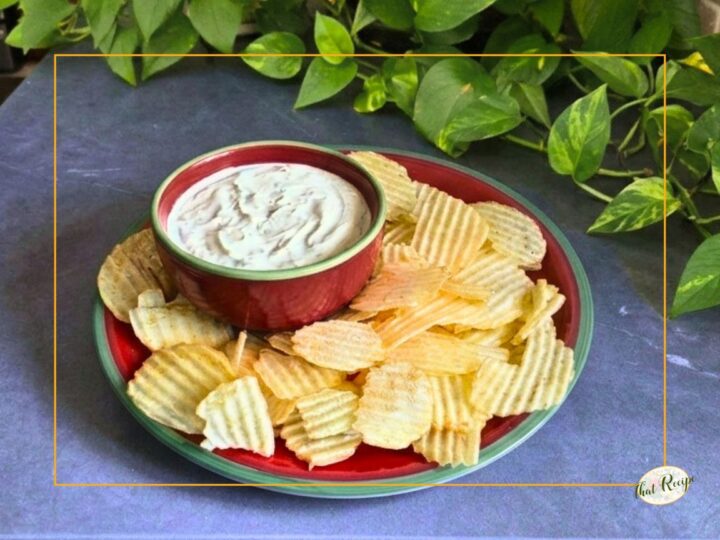 clam dip in a bowl with chips