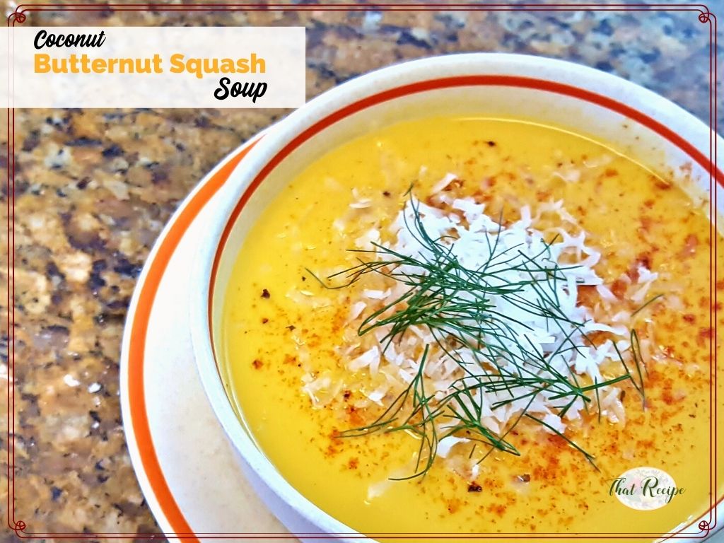 top down view of a bowl of butternut squash soup with text overlay "coconut butternut squash soup"