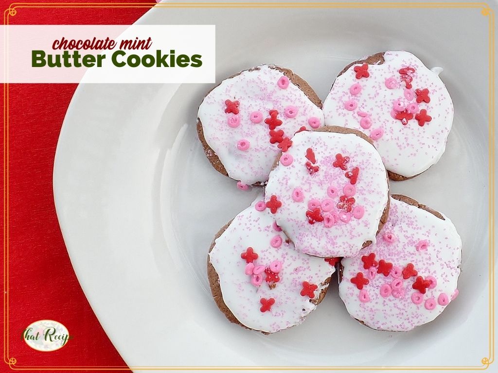 top down view of frosted cookies on a plate with text overlay "chocolate mint butter cookies"