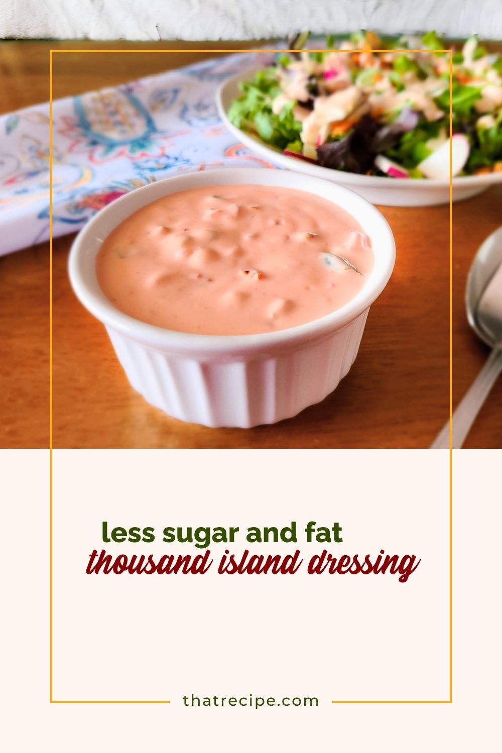 cup of thousand island dressing with a salad