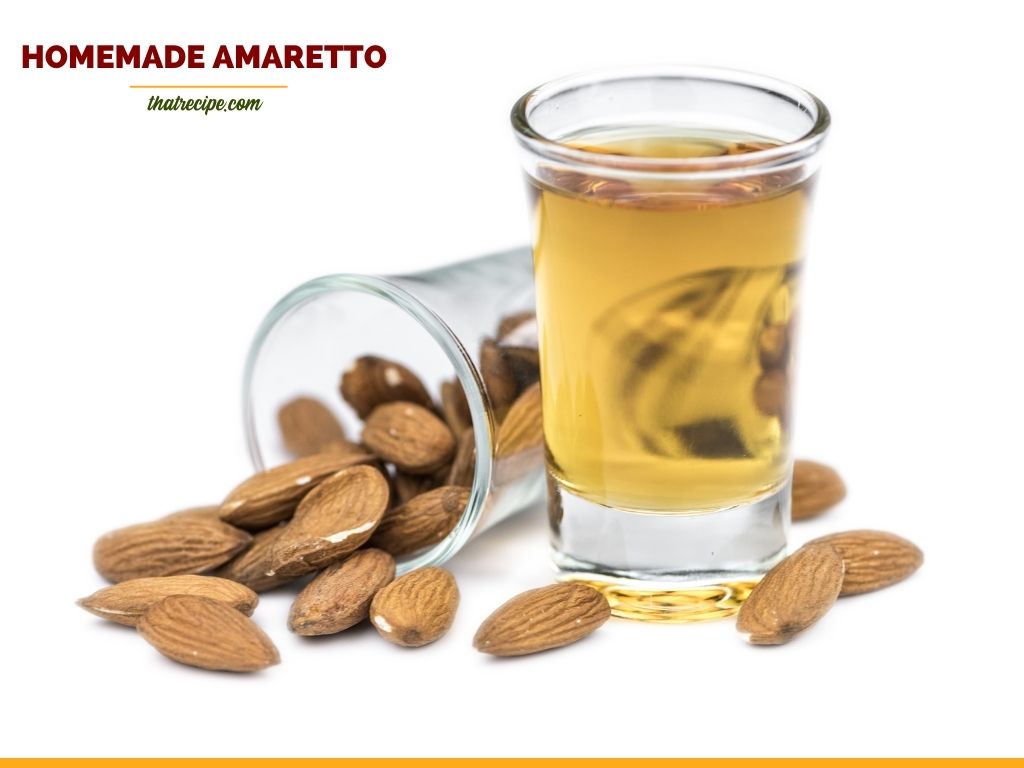 Amaretto in a cordial glass surrounded by almonds with text overlay "homemade Amaretto"