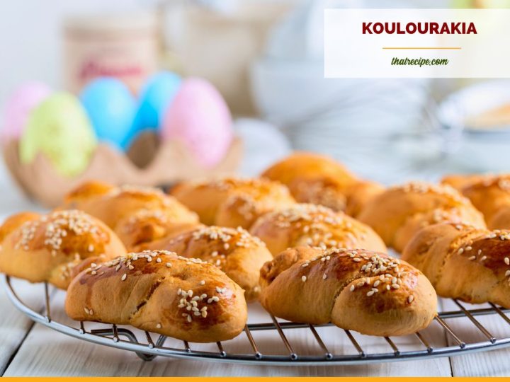 orange cookies on a plate with text overlay "Koulourakia Greek Easter Cookies"