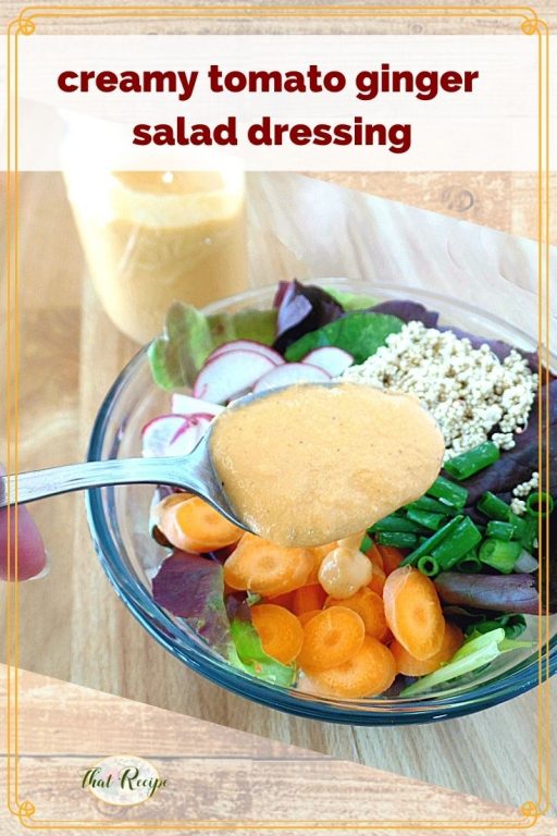 salad dressing on a spoon over a salad with text overlay "creamy tomato ginger salad dressing"