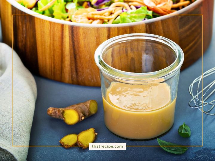 cup of salad dressing on a table