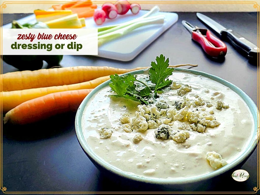 blue cheese dip in a bowl with vegetables on a cutting board and text overlay "zesty blue cheese dip or dressing"