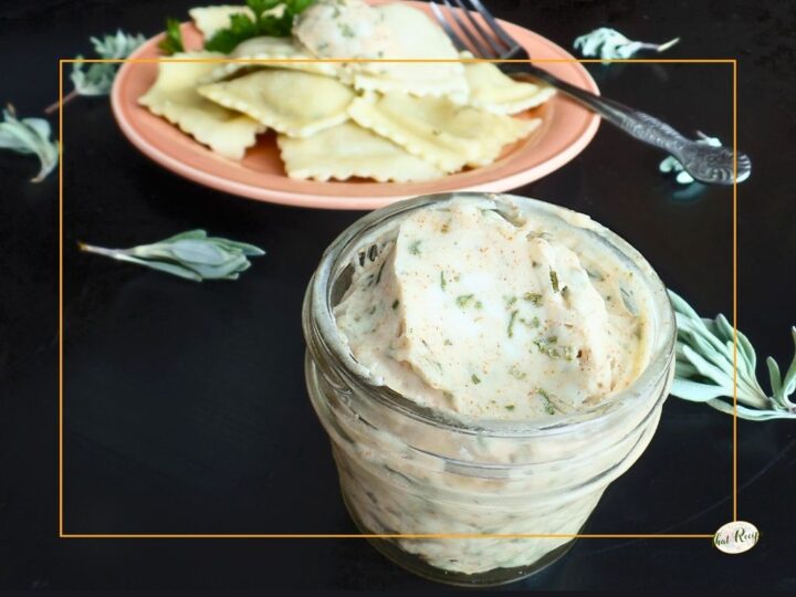 browned sage butter in a jar with a plate of pasta in background