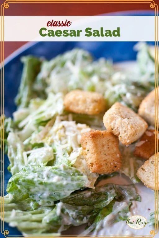 Close up of salad on a plate with text overlay "Classic Caesar Salad"