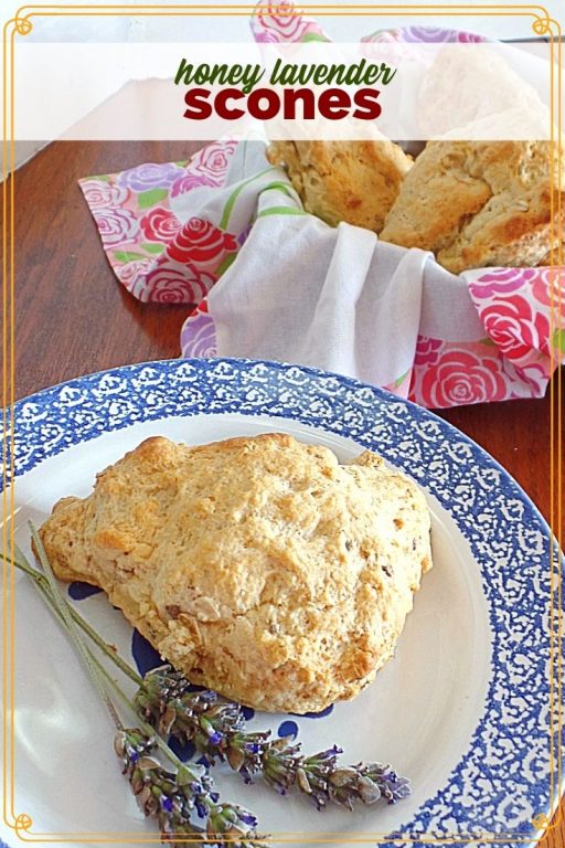 scone on a plate with fresh lavender and bowl of more scones in background with text overlay "honey lavender scones"