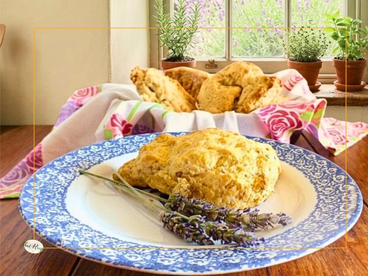 scone on a plate with fresh lavender blossoms