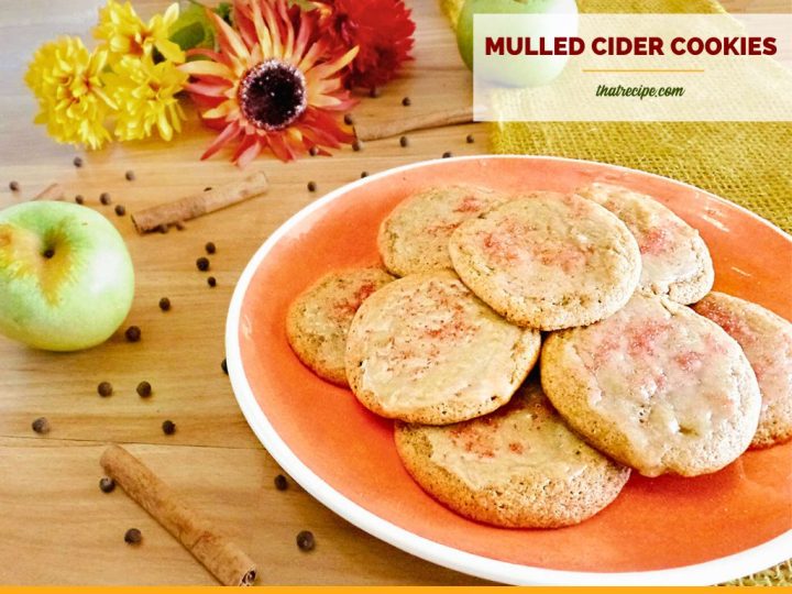 cookies on a plate surrounded by apples and spices with text overlay "mulled apple cider cookies"