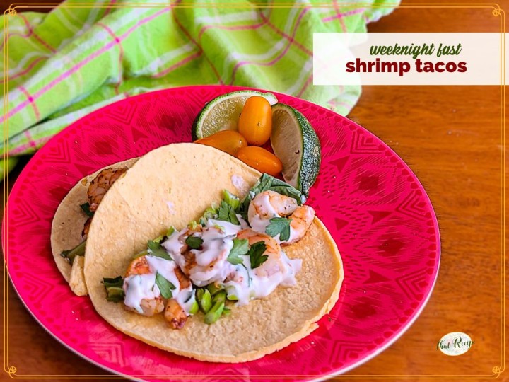 shrimp tacos on a plate with text overlay "weeknight fast shrimp tacos"