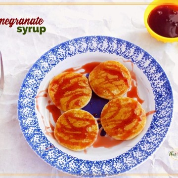pancakes on a plate with pomegranate syrup