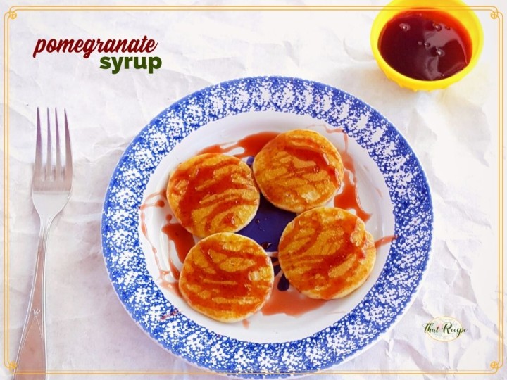 pancakes on a plate with pomegranate syrup