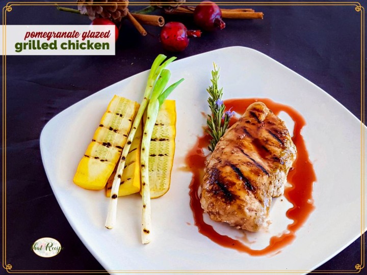 grilled chicken and vegetables on plate with text overlay pomegranate grilled chicken