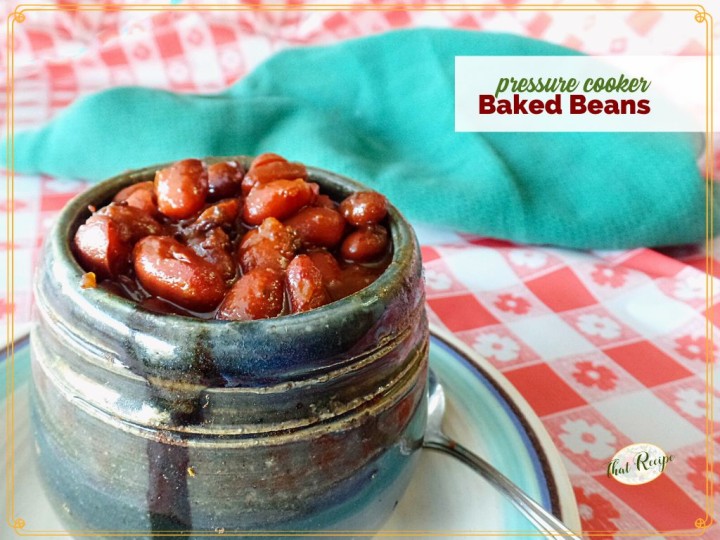 cup of cooked beans with text overlay "pressure cooker baked beans