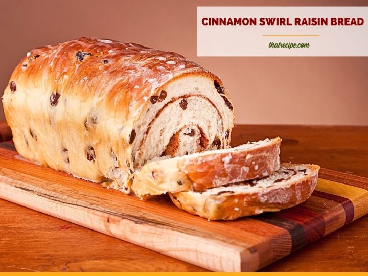 loaf of cinnamon swirl raisin bread on a cutting board