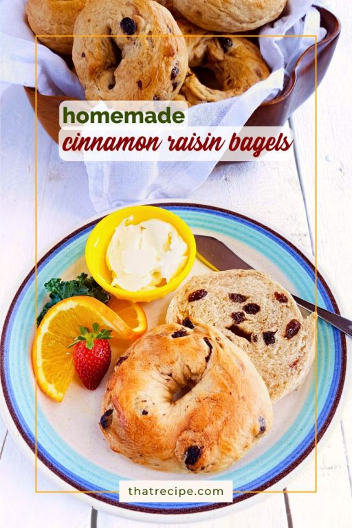 cinnamon raisin bagel on a plate with cream cheese orange slice and strawberry