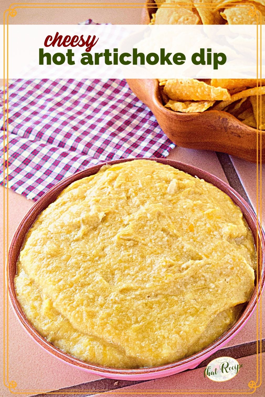 hot artichoke dip in a bowl next to tortilla chips